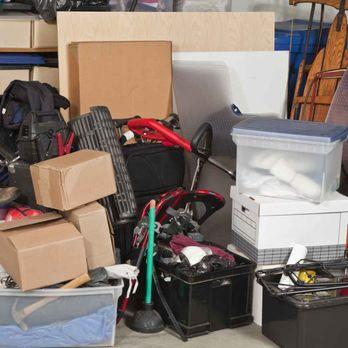 picture of junk in a garage consisting of many cardboard boxes