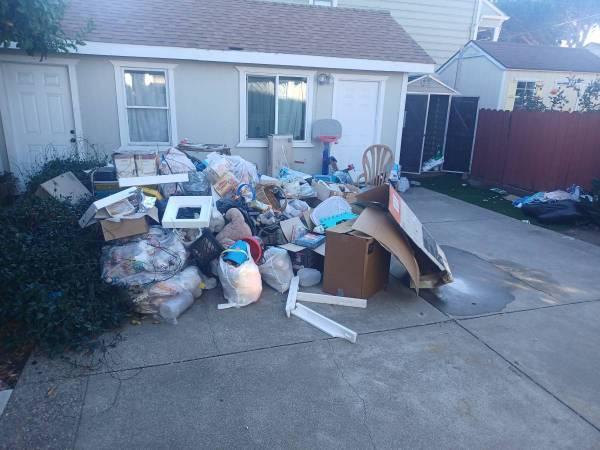 picture of junk outside a home waiting to be removed